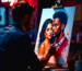 An artist painting a romantic watercolor portrait of a couple, highlighting the beauty of hand-painted art for Valentine's Day.